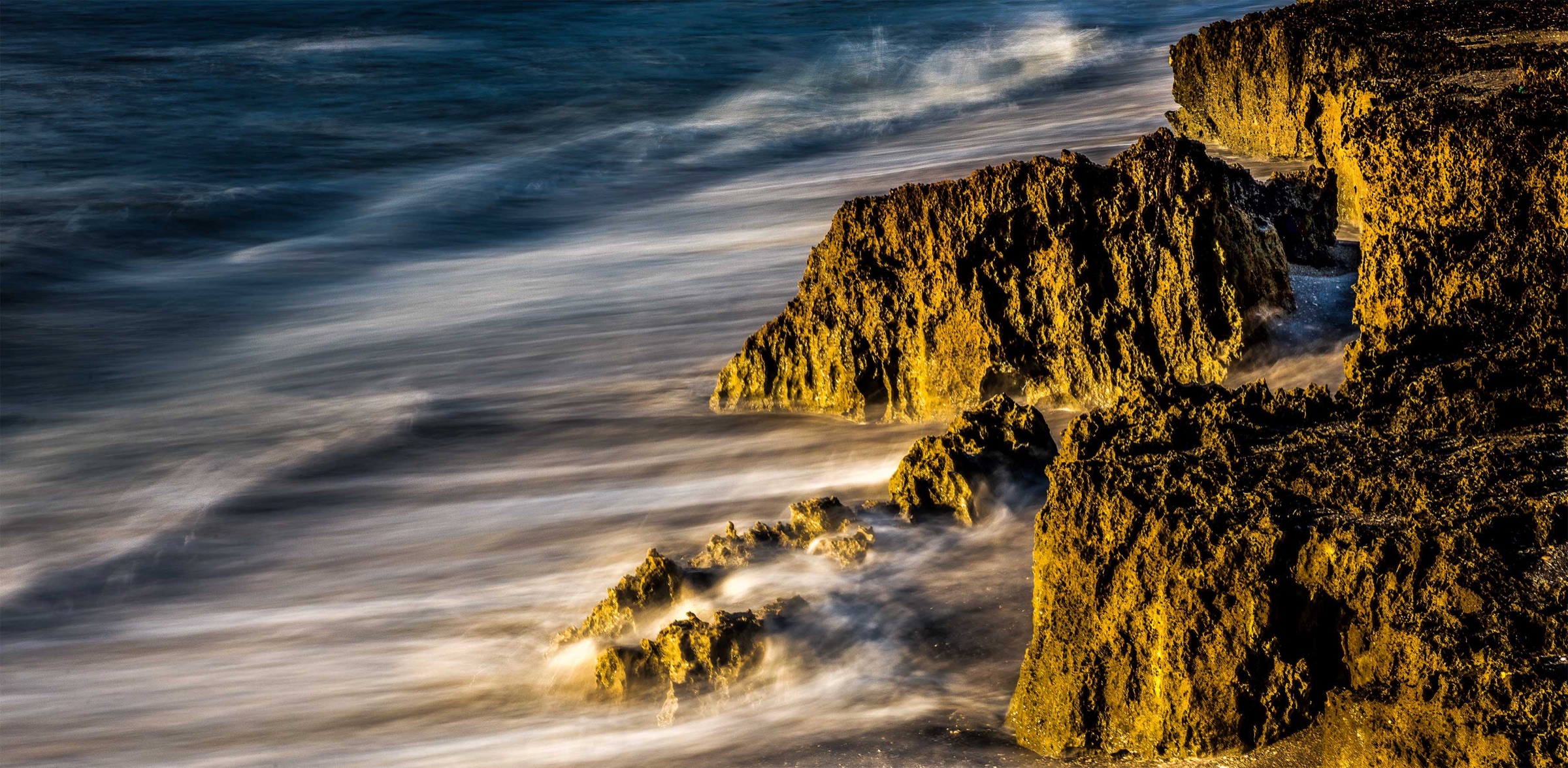 Atlantic waves washing over the Anastasia limestone outcrop at Blowing Rocks Preserve