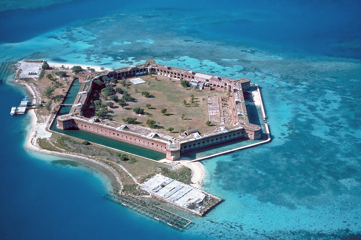 Aerial view of Fort Jefferson hexagonal brick fort surrounded by turquoise water at Dry Tortugas National Park, Florida