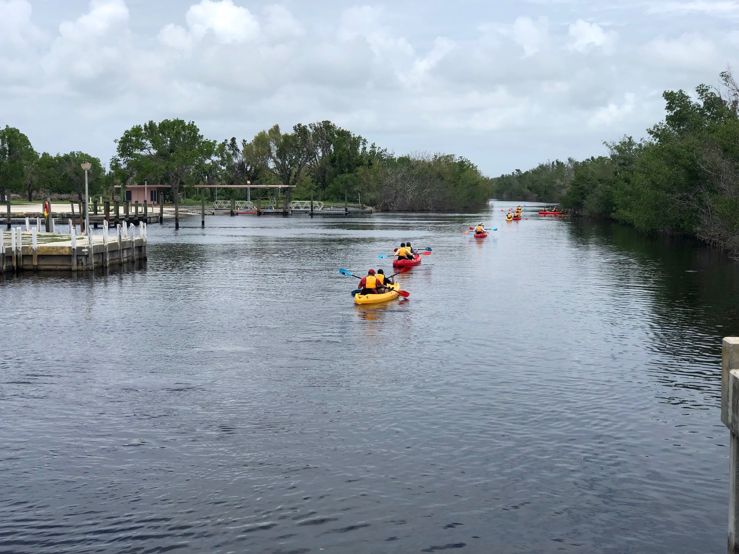 A kayaker paddling on the shallow, sun-lit waters of Florida Bay near Flamingo in Everglades National Park