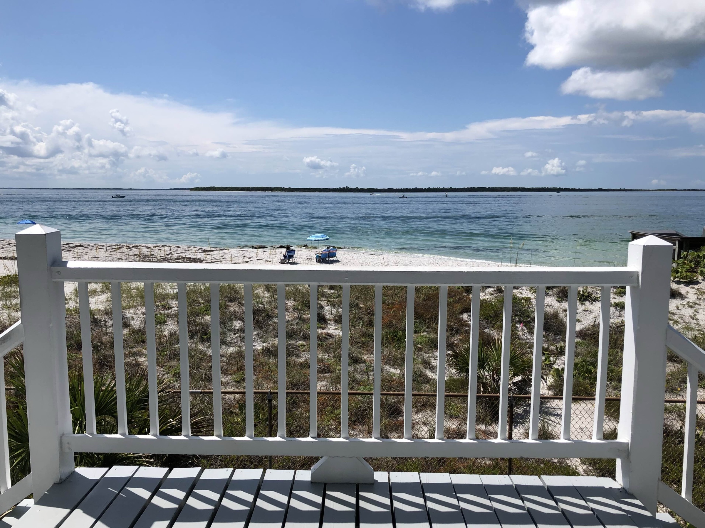 White sand beach at the southern tip of Gasparilla Island State Park with turquoise Gulf water and Boca Grande Pass visible in the background