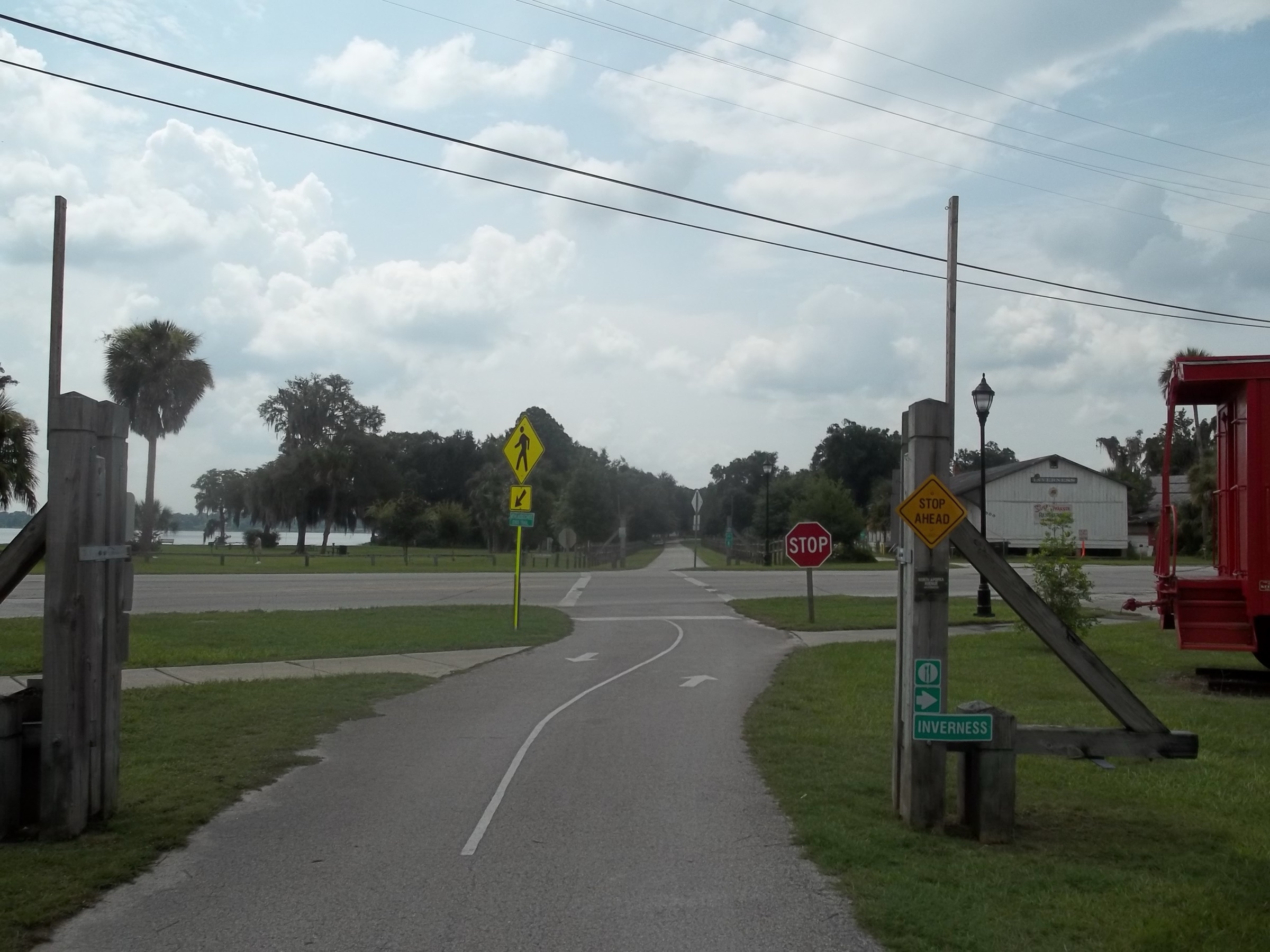 Paved Withlacoochee State Trail corridor stretching east through Central Florida scrubland near Inverness